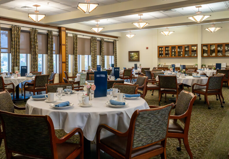 Library and Reading Room with Bookshelves at Senior Living Community memory-care-community