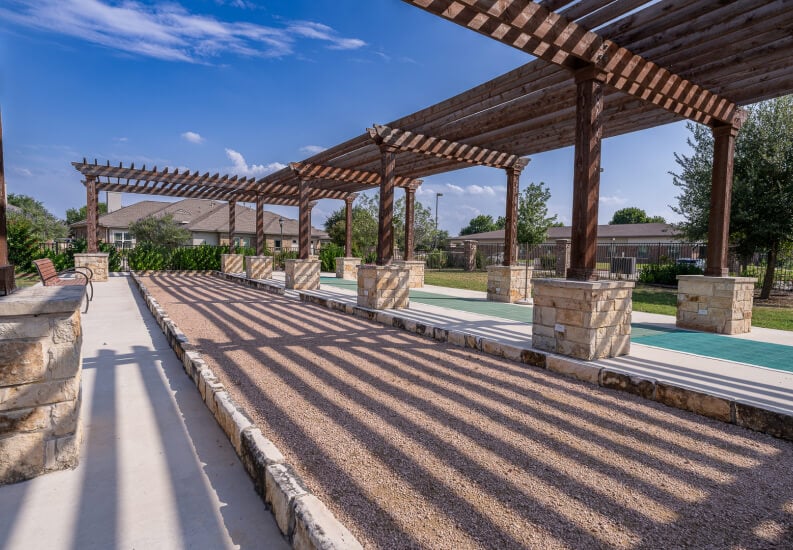 Shaded Outdoor Recreation Area for Elderly Residents at Independent Living Facility Shaded Outdoor Recreation Area for Elderly Residents at Independent Living Facility